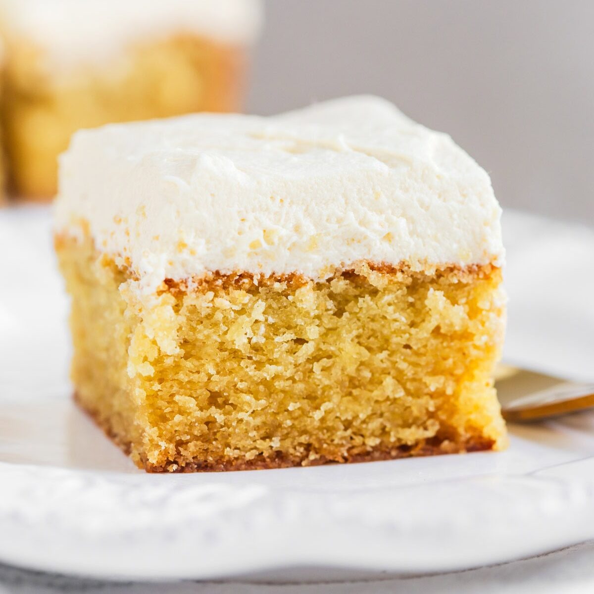 Slice of vanilla cake without milk and eggs on plate.