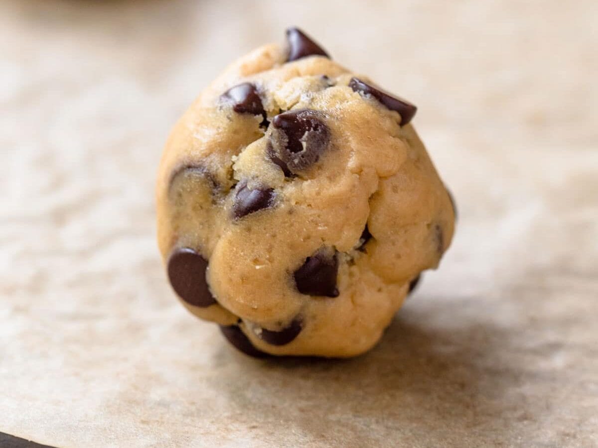 Close up image of cookie dough ball, do not flatten it before baking