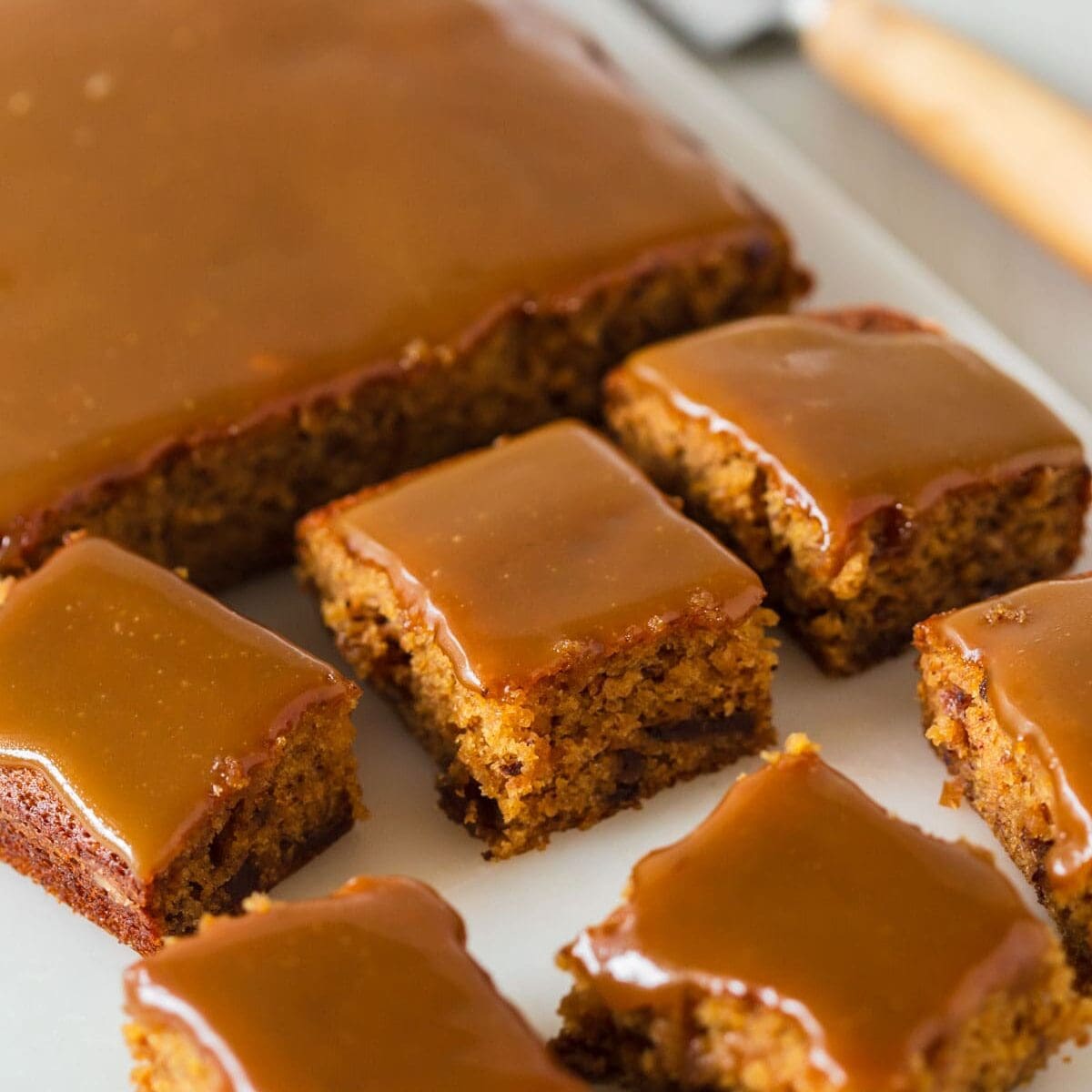 Sticky date slice on platter.